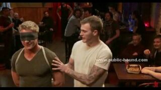 Gay hunks gathered in public bar